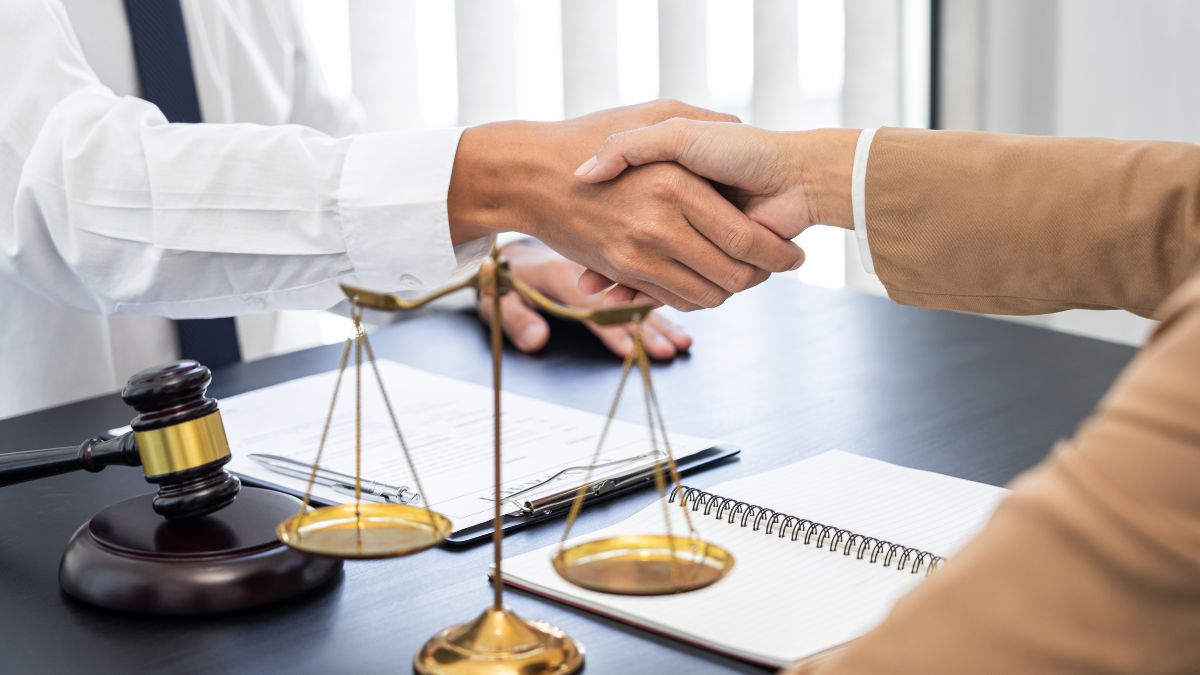 A handshake over a scale of justice, representing the complexities of trusteeship and the need for legal advice.