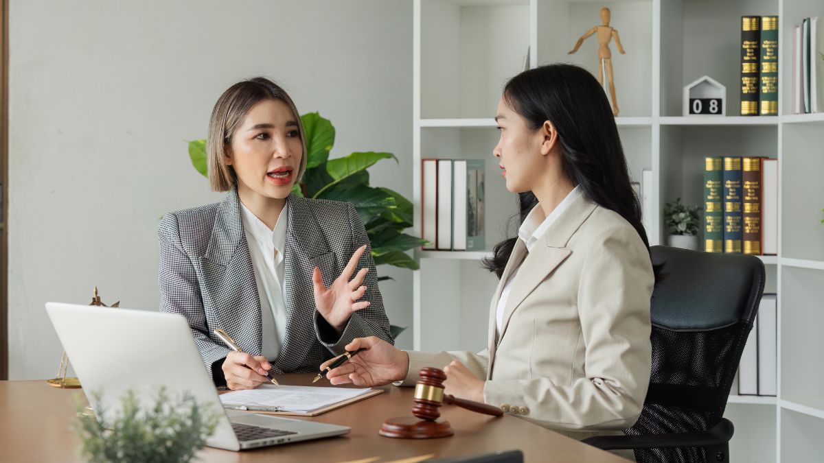 Business professionals discuss trust beneficiaries' roles, rights, and common mistakes in a modern office environment.
